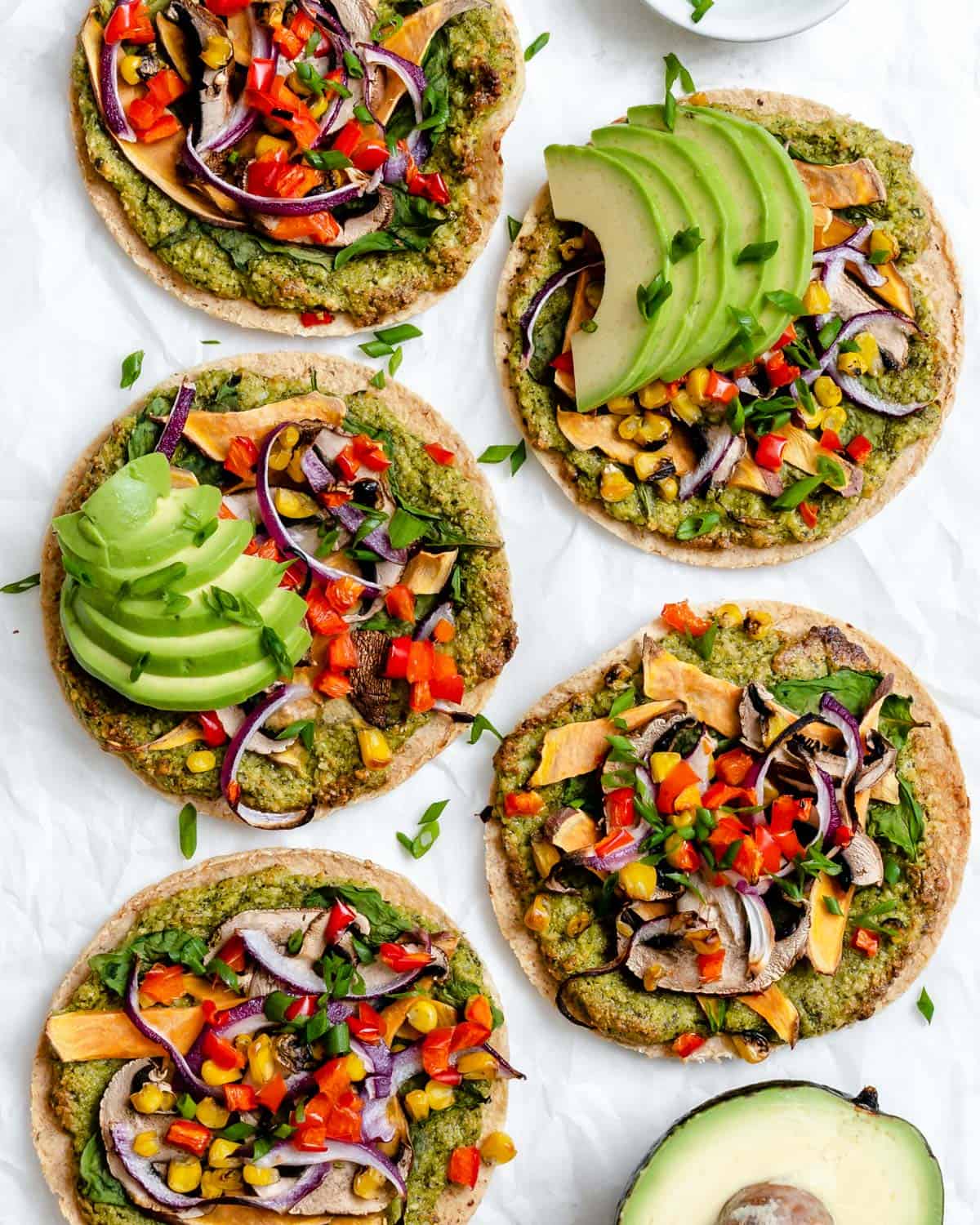 several completed Vegan Tortilla Pizzas against a white background