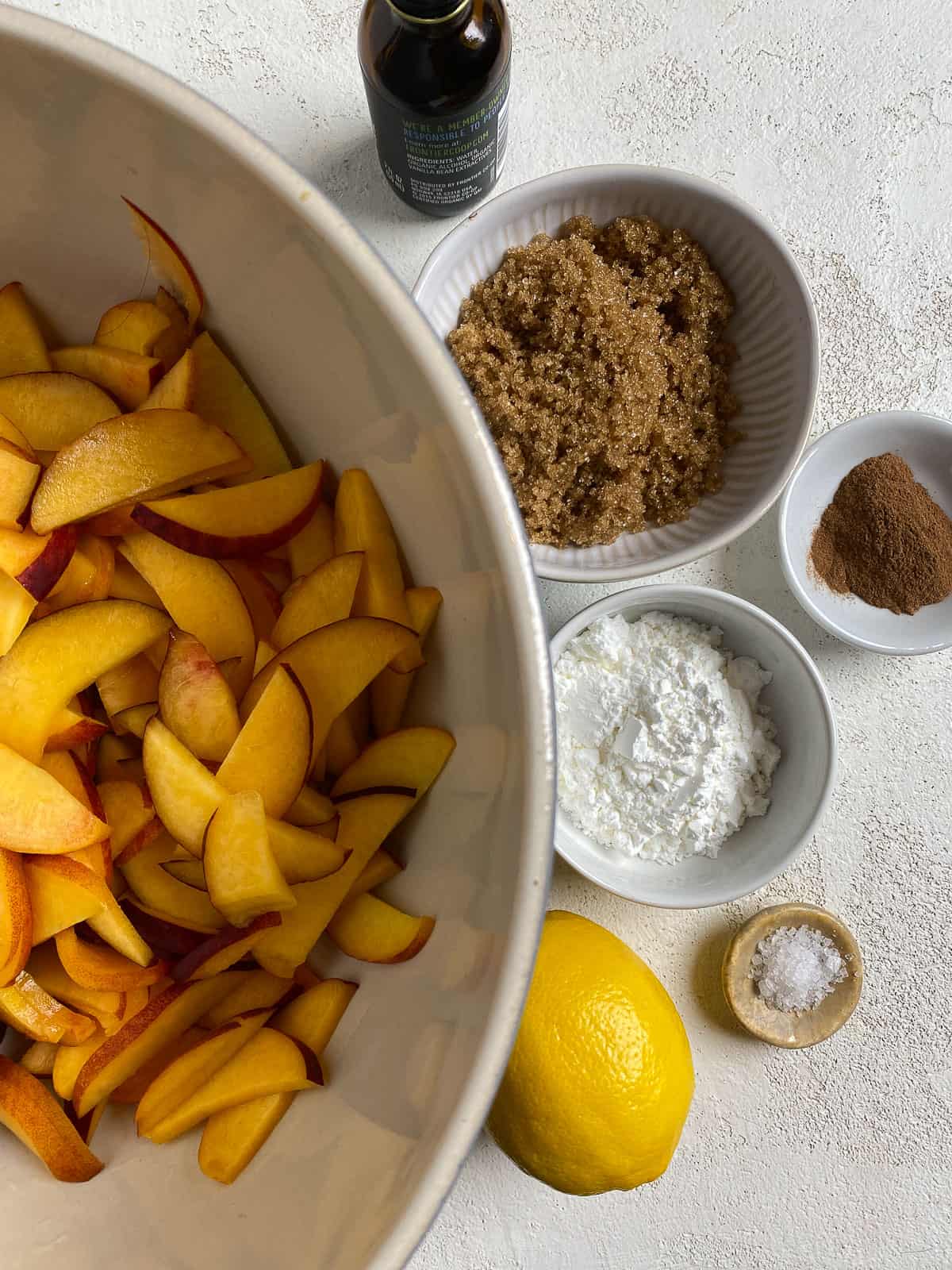 ingredients for peach crumb pie against a white background