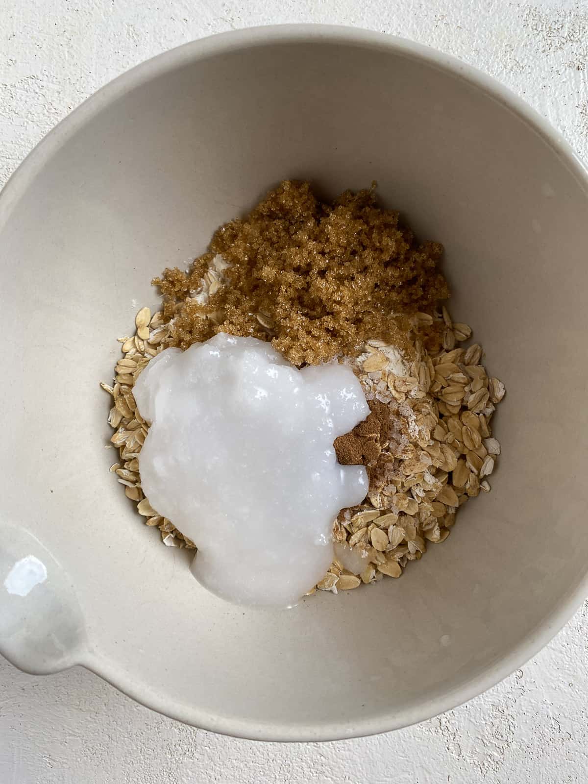 process of adding ingredients for filling in white bowl