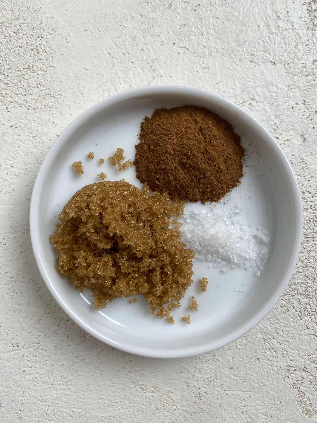 sugar, cinnamon, and salt in a white bowl