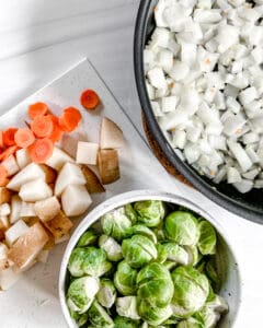 process of brussels sprouts curry being made with ingredients measured out around the pan