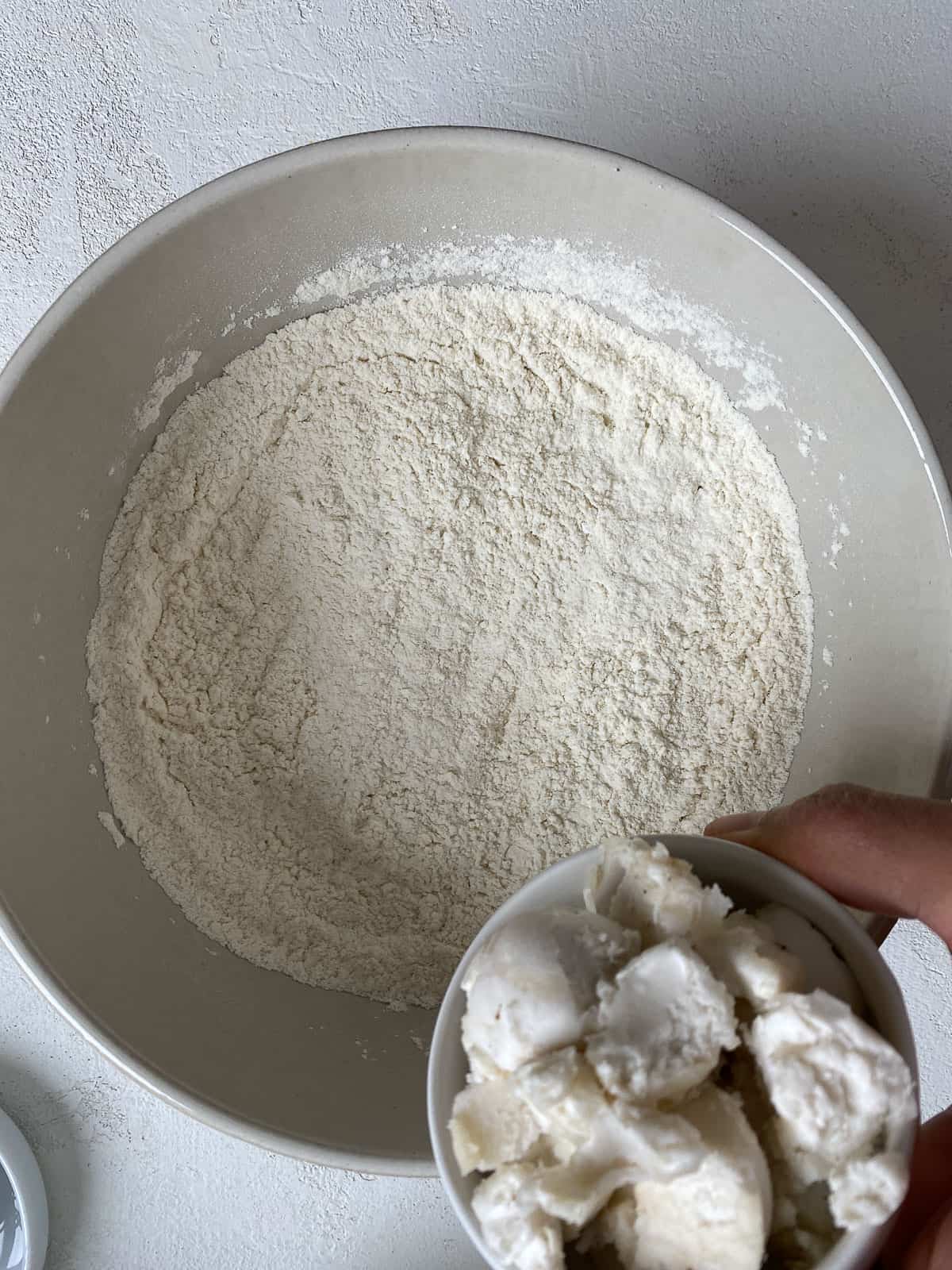 process of adding vegan butter to bowl