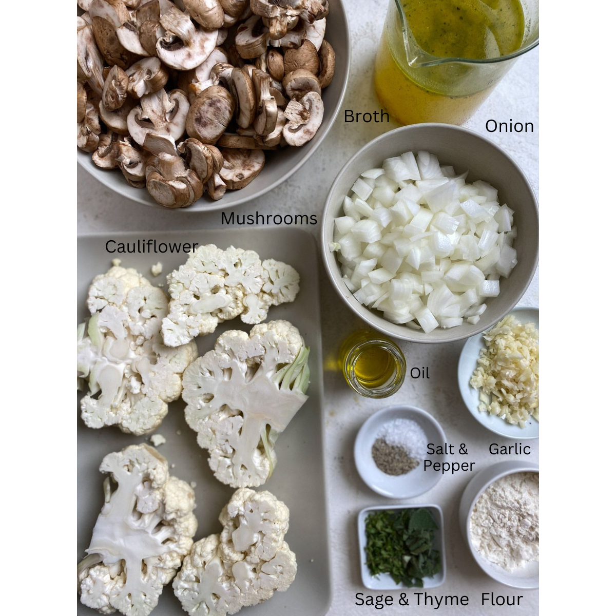 ingredients for Cauliflower Steaks and Mushroom Gravy measured out against a white surface