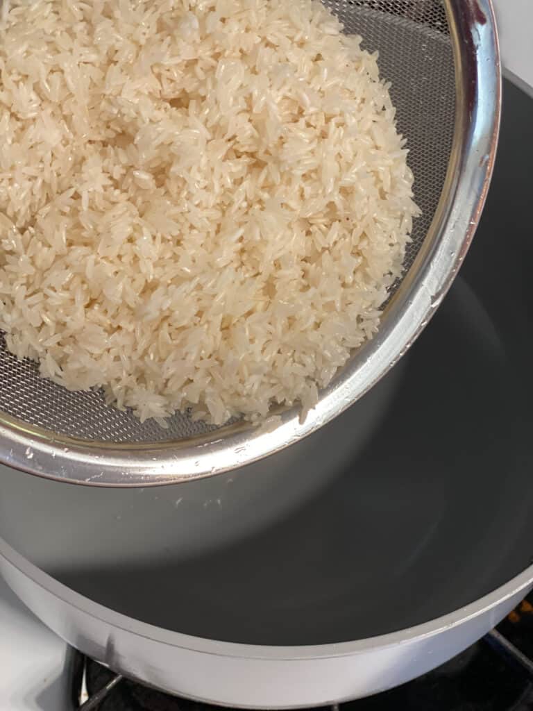 process shot of straining rice