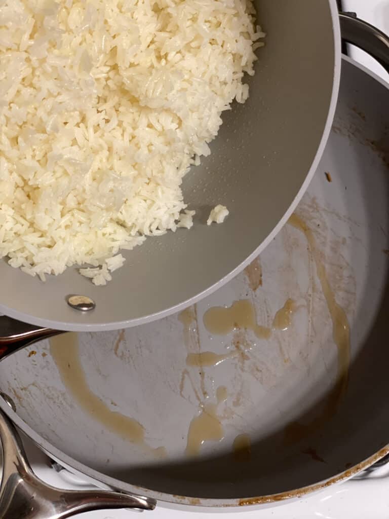 process shot of adding rice to pan