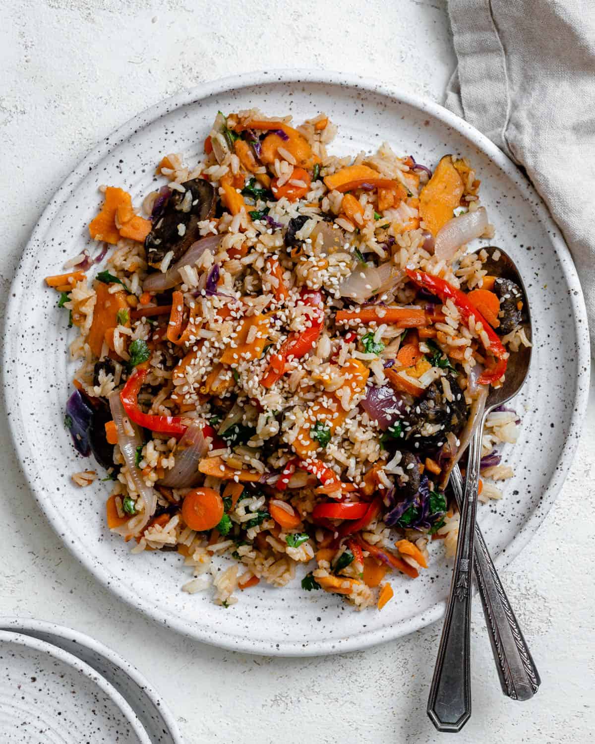 completed Rainbow Veggie Lentil Fried Rice plated on a white plate