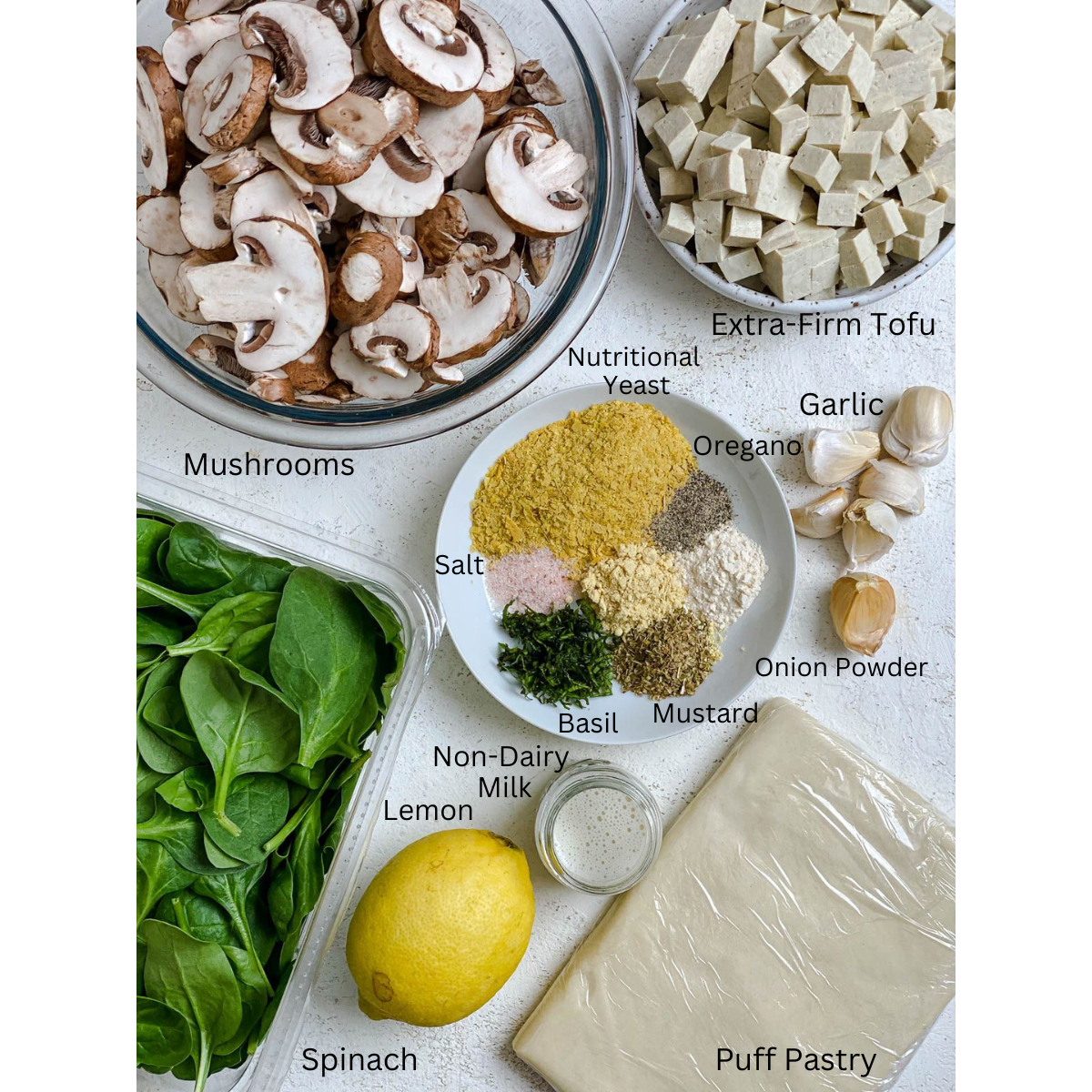 ingredients for Spinach Mushroom Pockets measured out a،nst a white surface