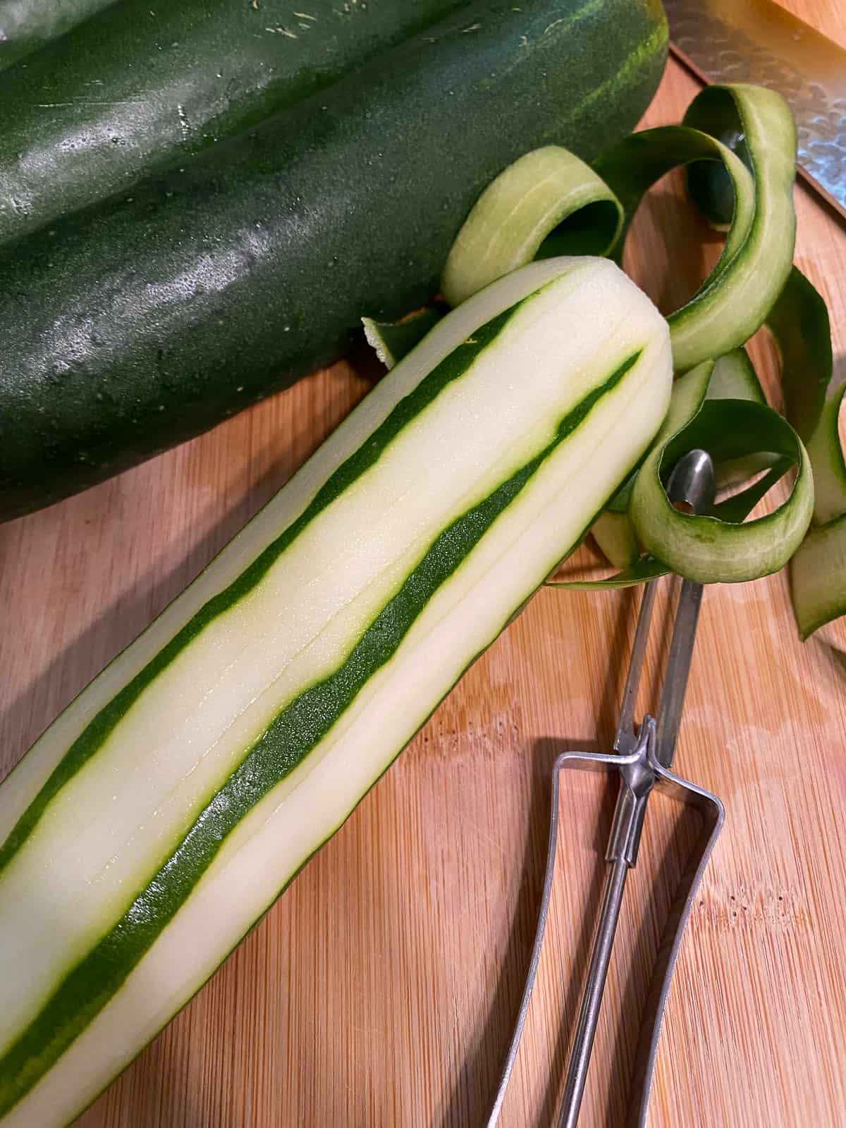 process shot demonstrating peeling of cucumber