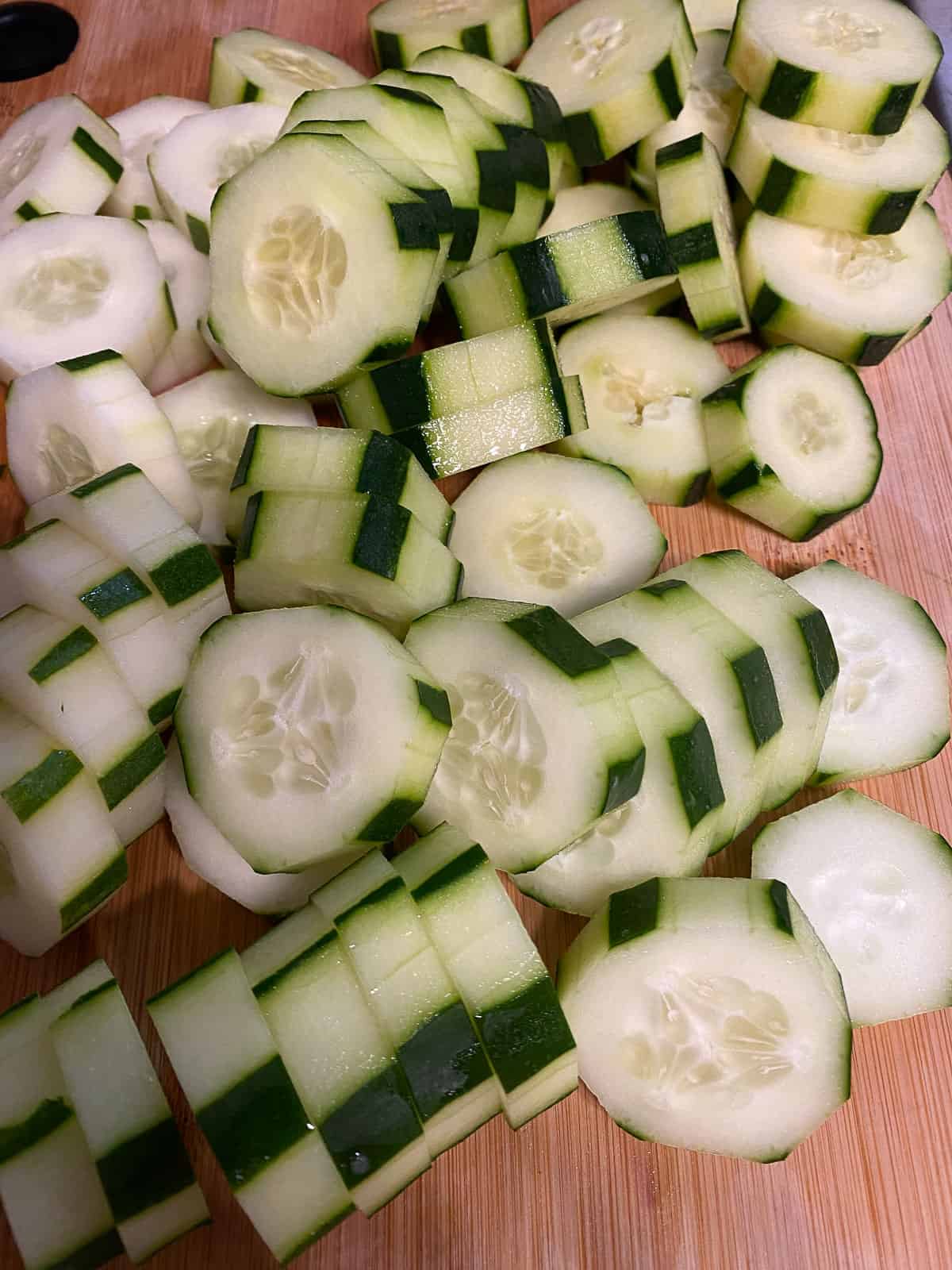 several sliced cucumbers on a cutting board