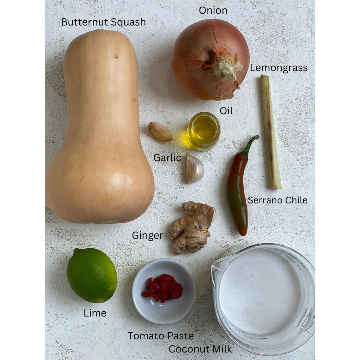 Ingredients for Thai style butternut squash soup measured on a white surface