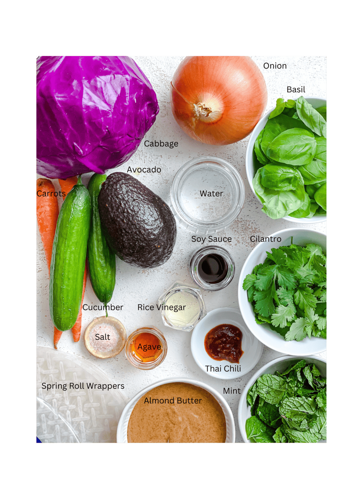 ingredients for Fresh Rainbow Rolls with Almond Shallot Sauce measured out against a white surface