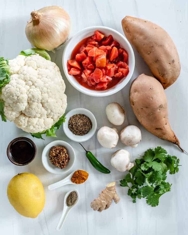 ingredients measured out for Cauliflower Sweet Potato Mushroom Curry