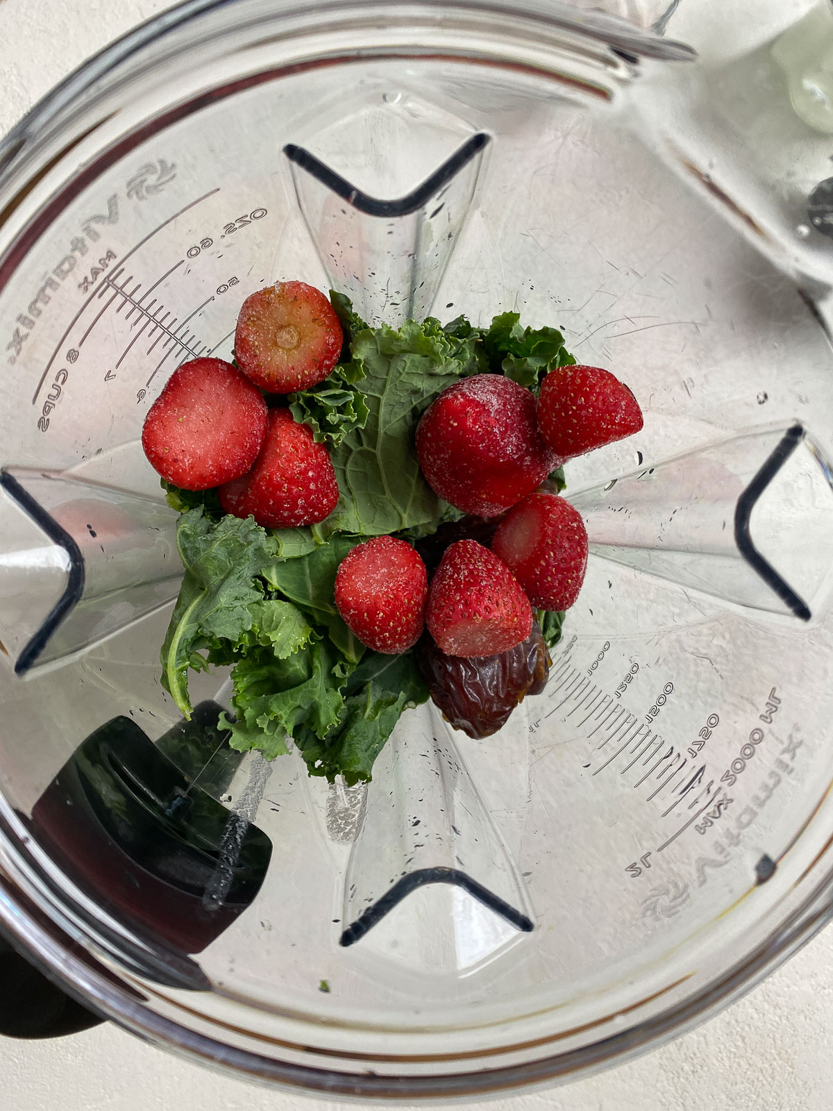 ingredients for Strawberry Kale Smoothie in a blender