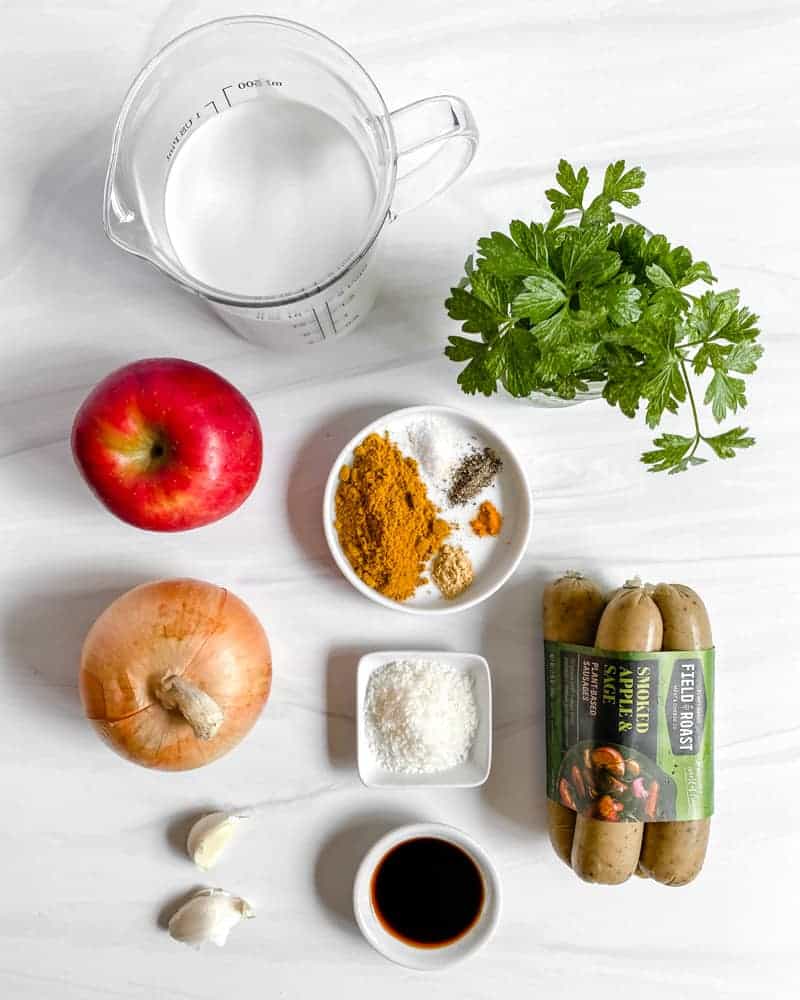 Vegan Coconut Curry with Apples ingredients measured out against a white marble background