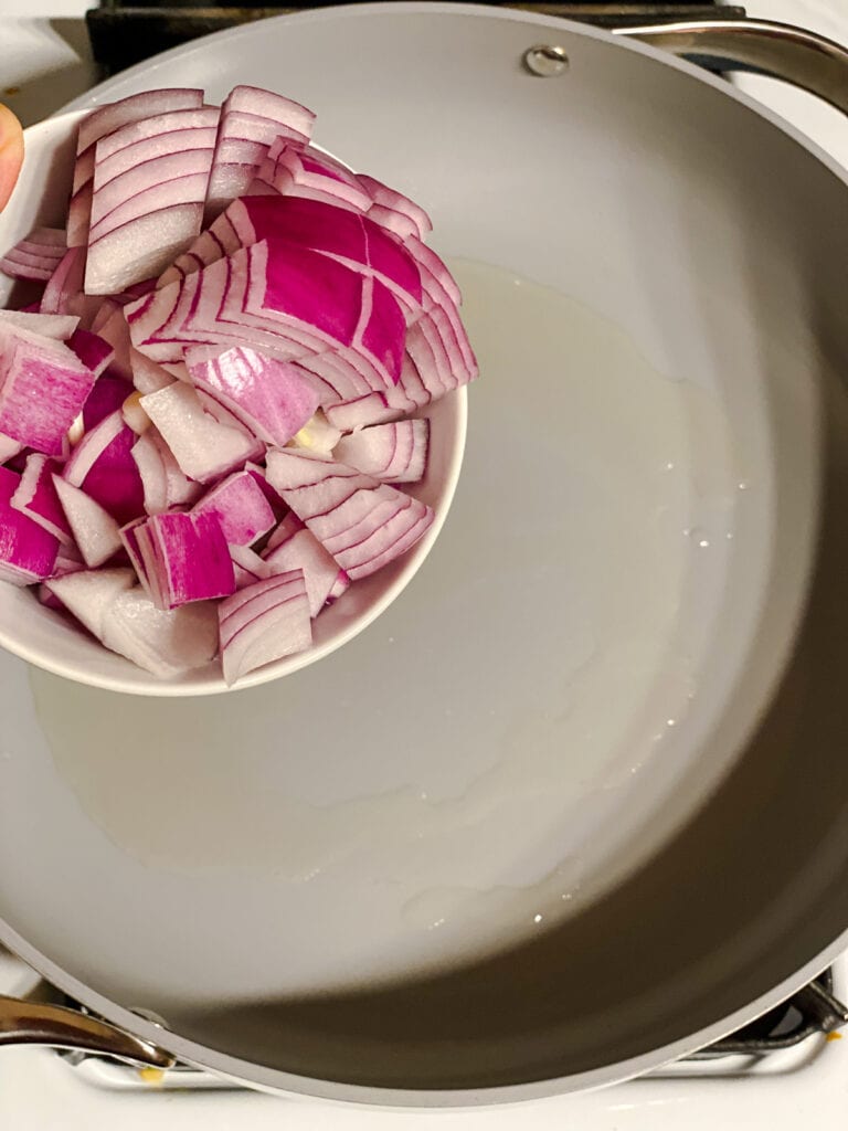 process s،t of adding onions to pan