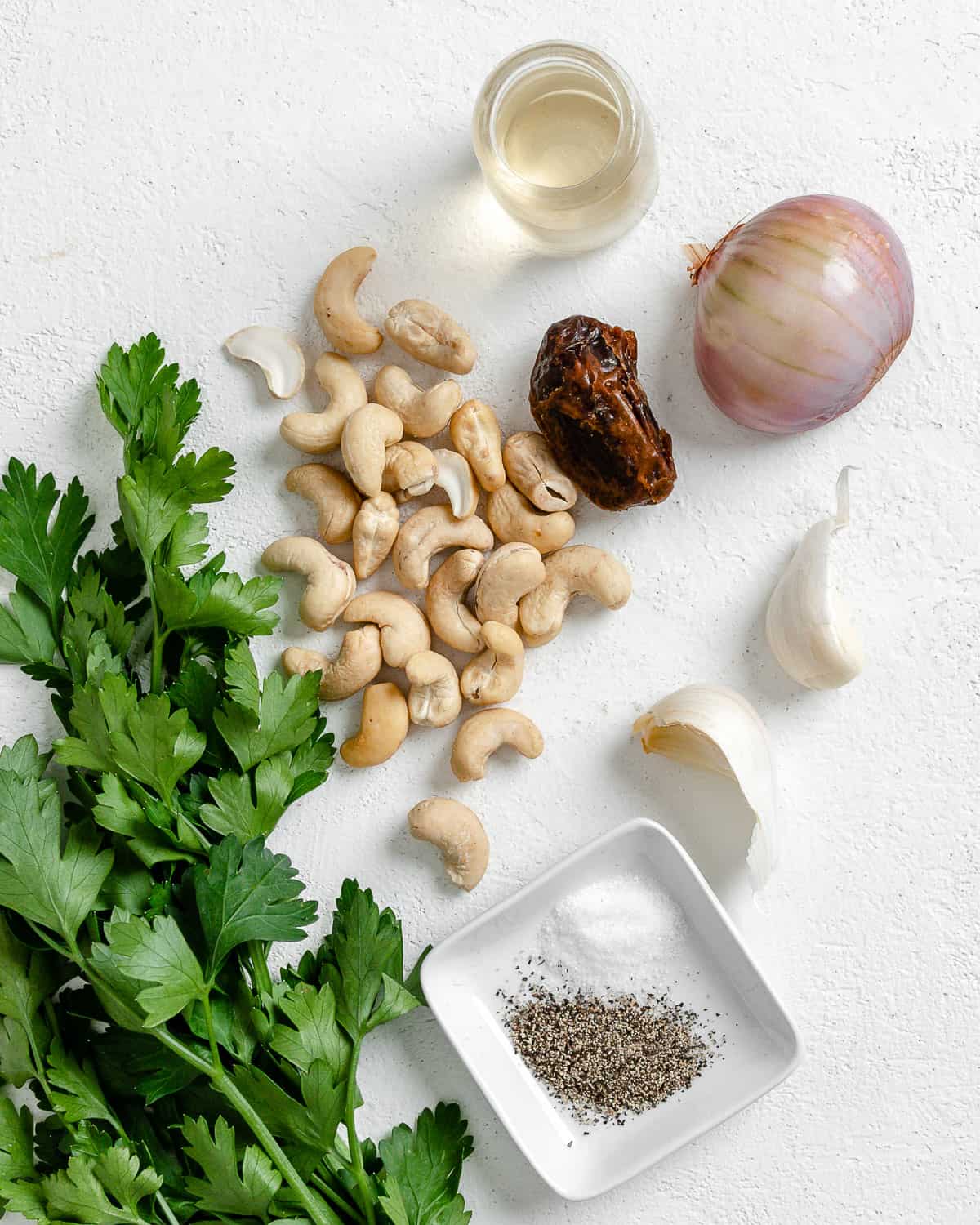 ingredients for Creamy Vegan Garlic Sauce against a white background