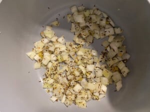 process shot of onions being cooked in pan