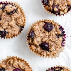 completed Individual Peanut Butter Oatmeal Cups scattered against a white surface