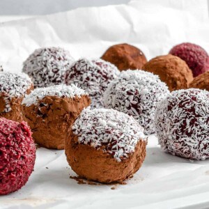 completed beet energy balls placed on a white surface