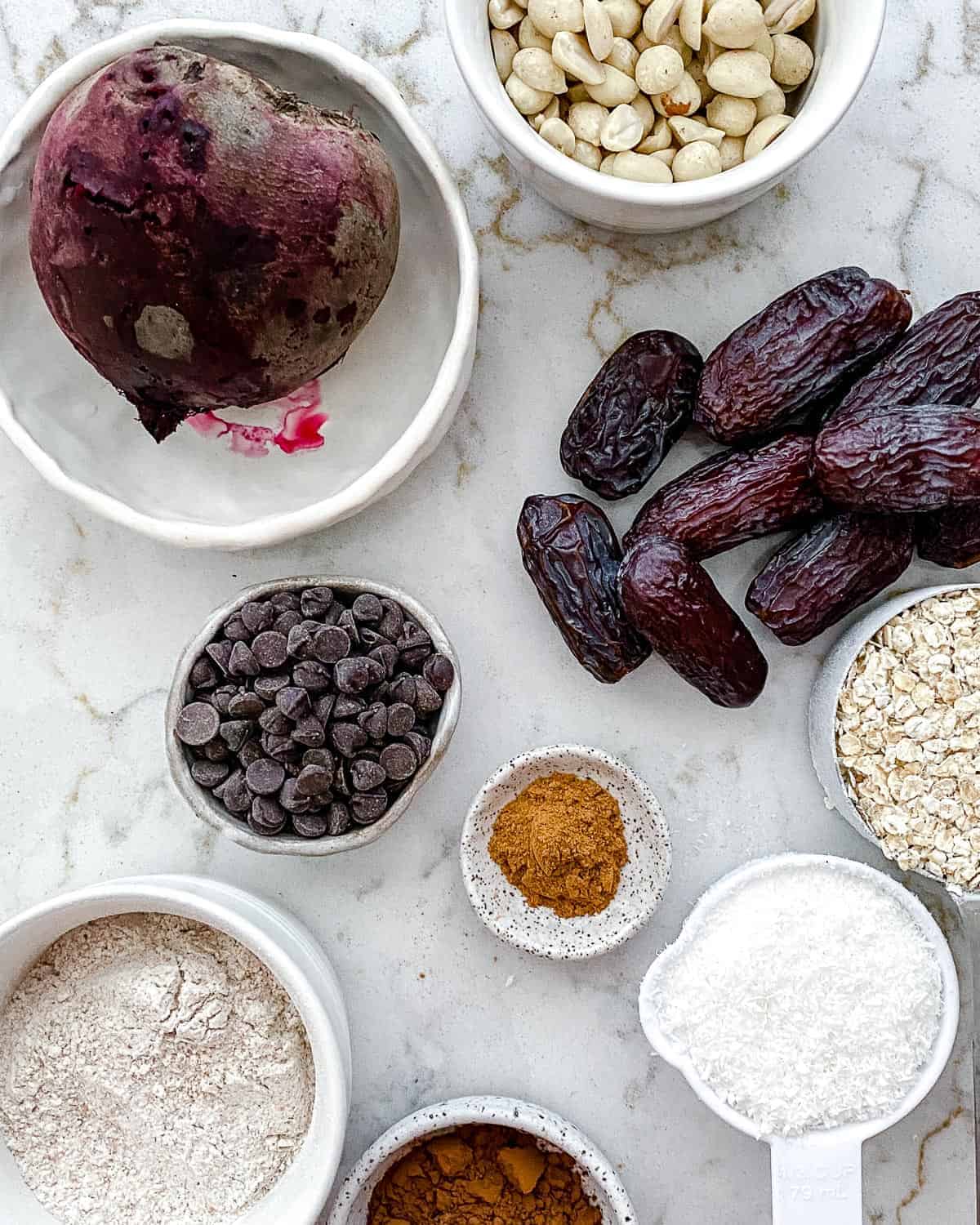 ingredients measured out for Beet Energy Balls against white surface