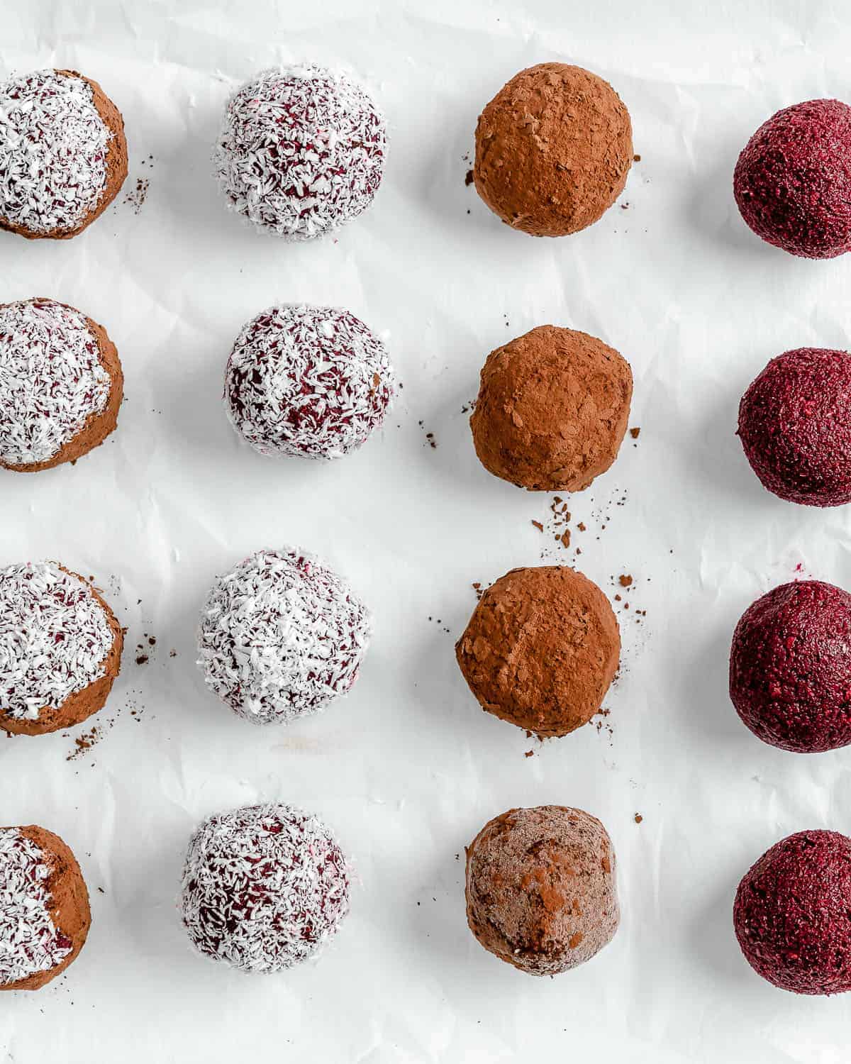 completed beet energy balls placed on a white surface