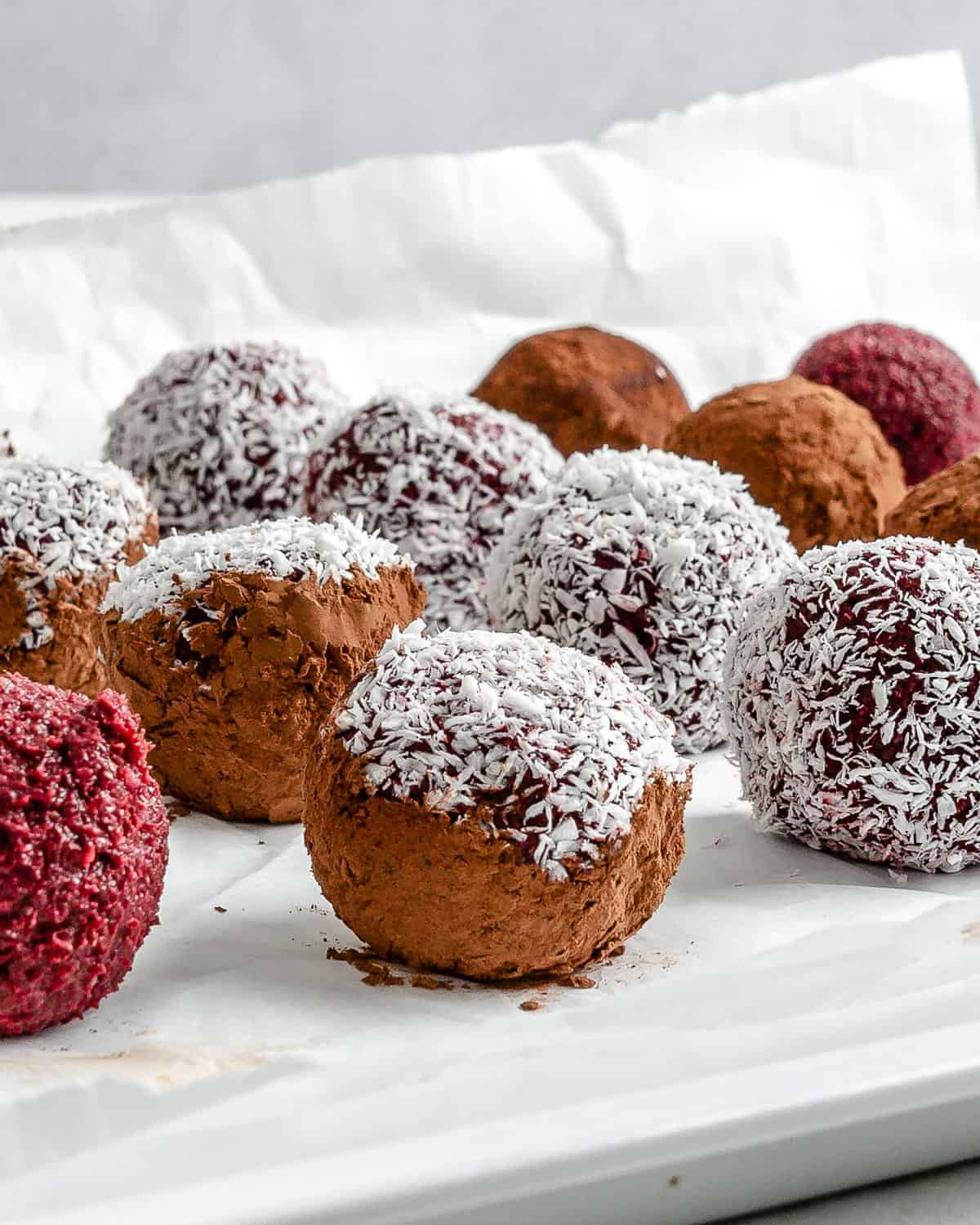 completed beet energy balls placed on a white surface