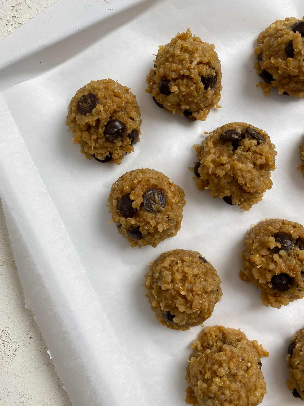 pre-frozen Vegan Chocolate Chip Quinoa Cookies on a baking sheet
