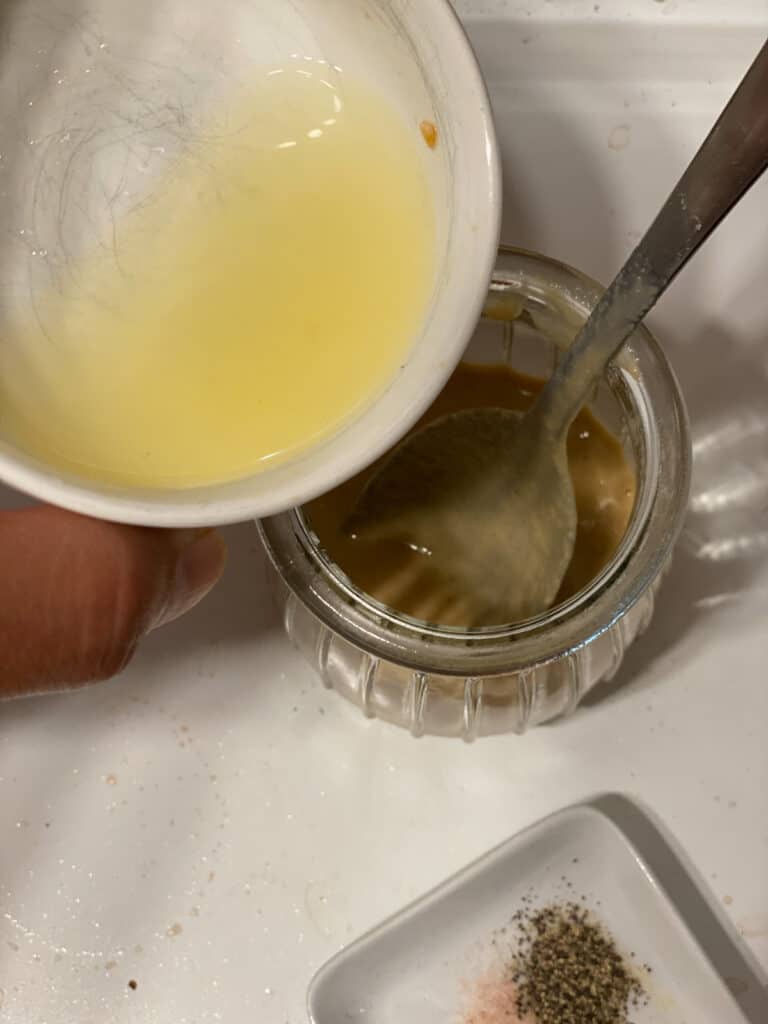 process shot of adding lemon juice to jar