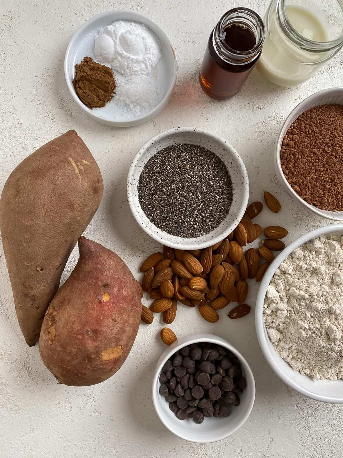 ingredients for Sweet Potato Chocolate Cake measured out against a white surface