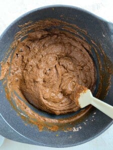 process of mixing sweet potato mixture together in a bowl