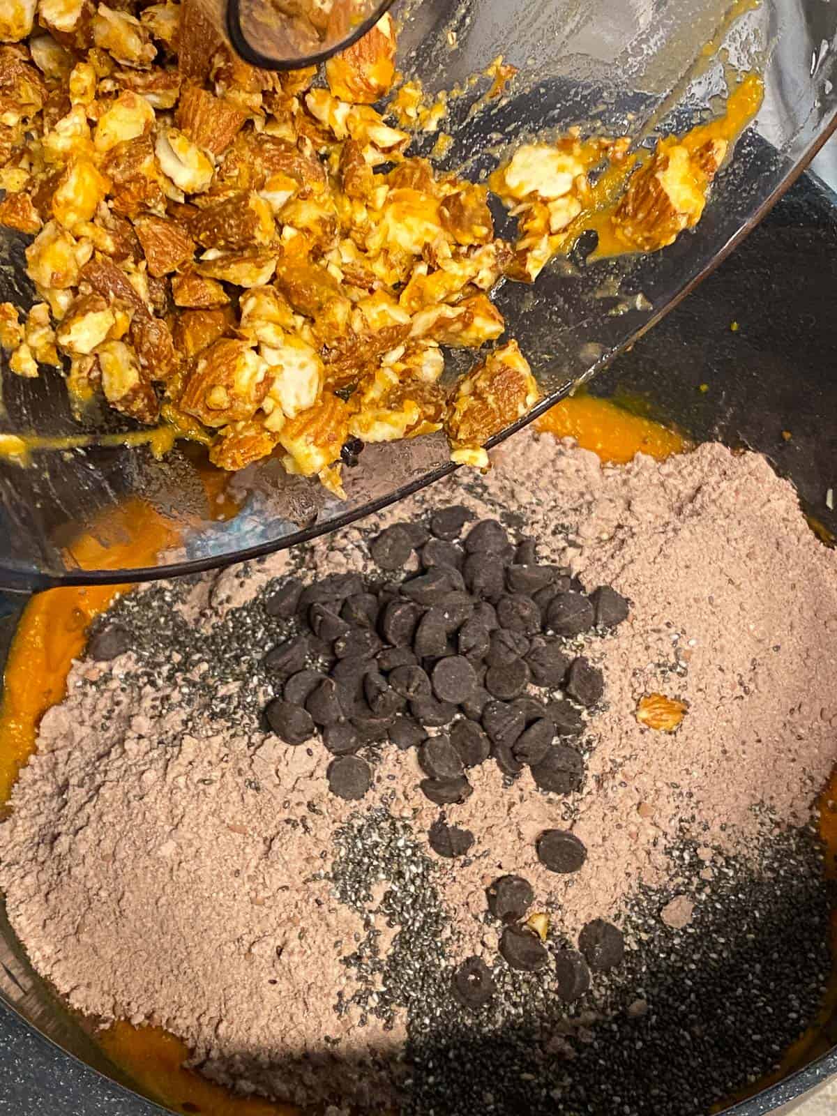 process shot of adding crushed almonds to sweet potato mixture
