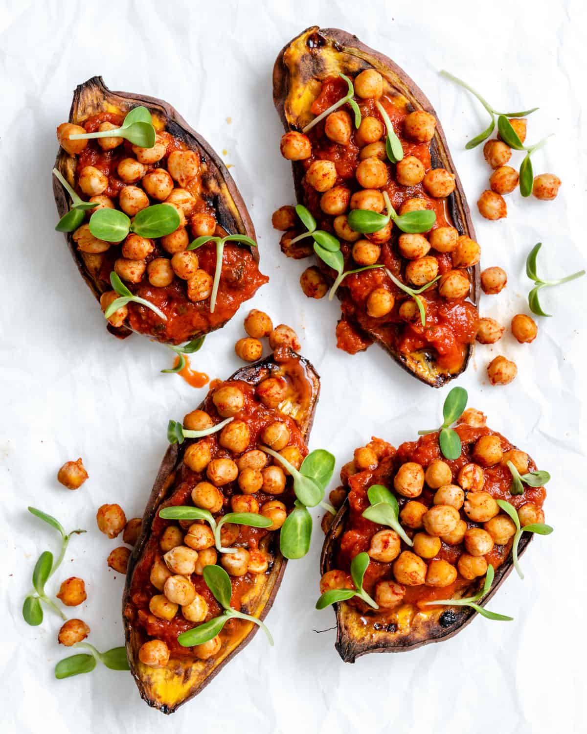 completed Chickpea Sweet Potato Boats a،nst a white surface
