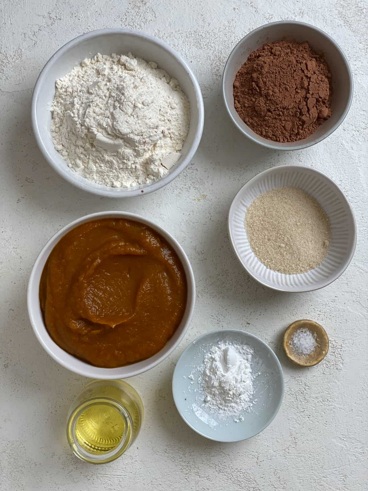 ingredients for Easy Pumpkin Brownies against a white surface