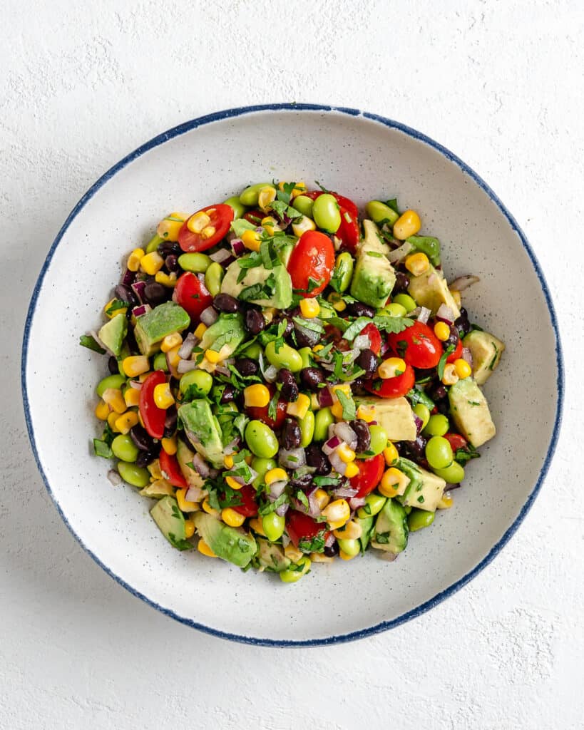 completed bowl of Easy Edamame Salad against a white background