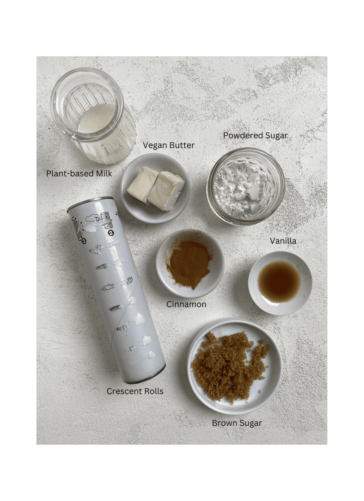 ingredients for Cinnamon Rolls measured out against a white surface