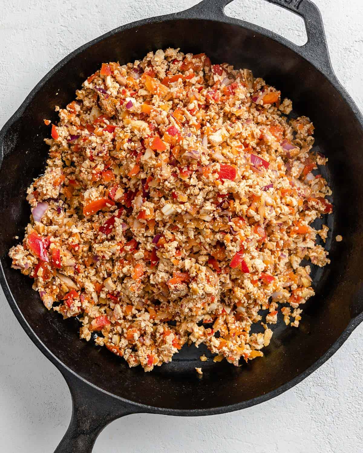 process shot of tofu taco filling in black skillet