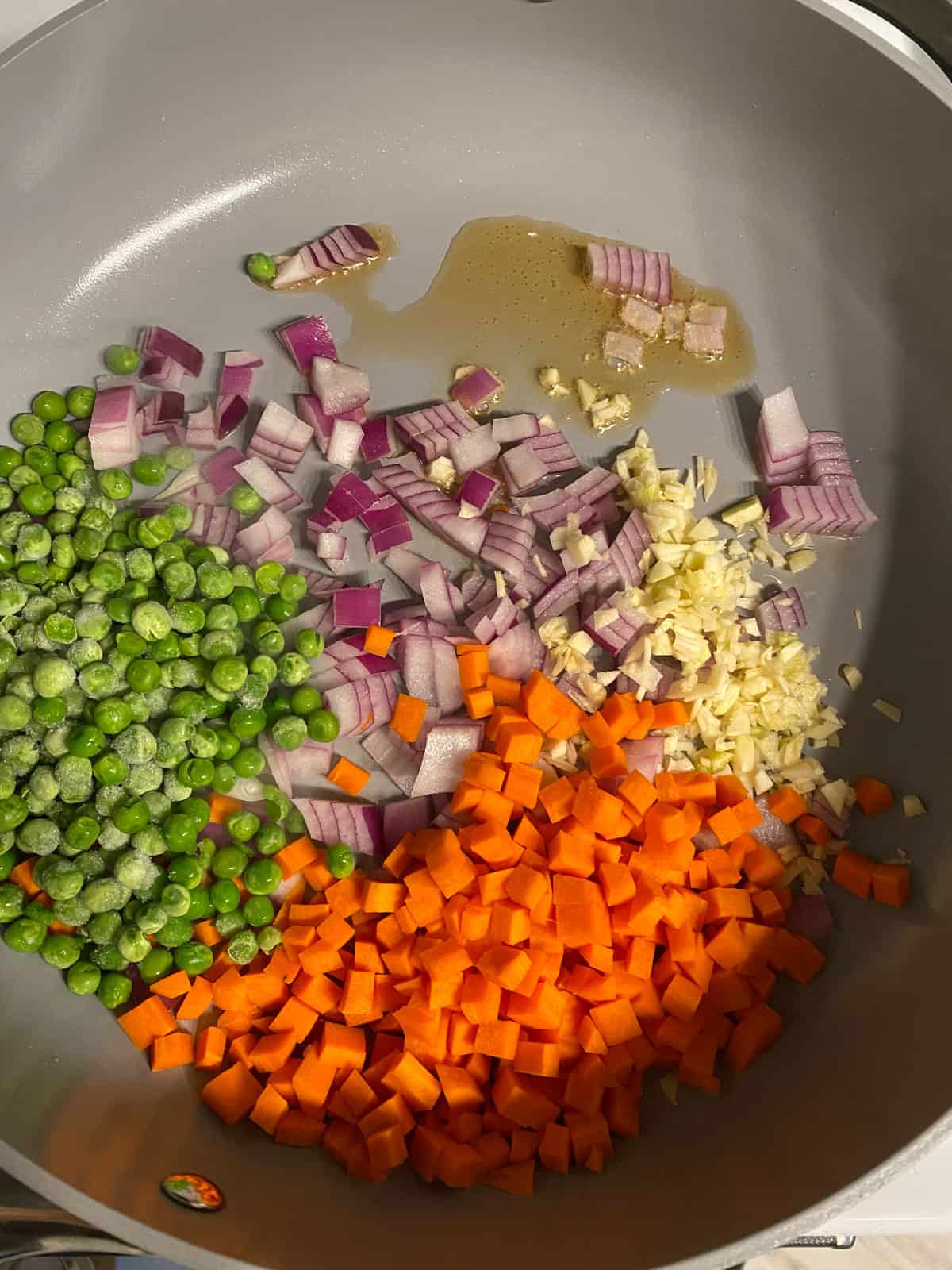 ingredients for Easy Vegetable Brown Fried Rice added to a pan