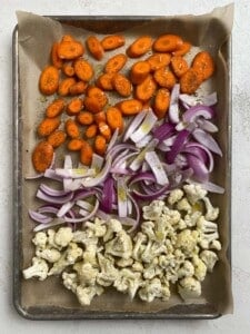 sliced veggies on a baking tray