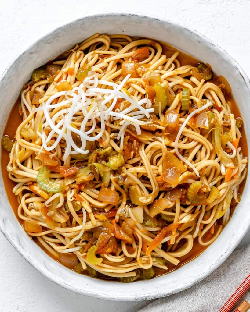 completed bowl of Veggie Chow Mein in a white bowl against a white background