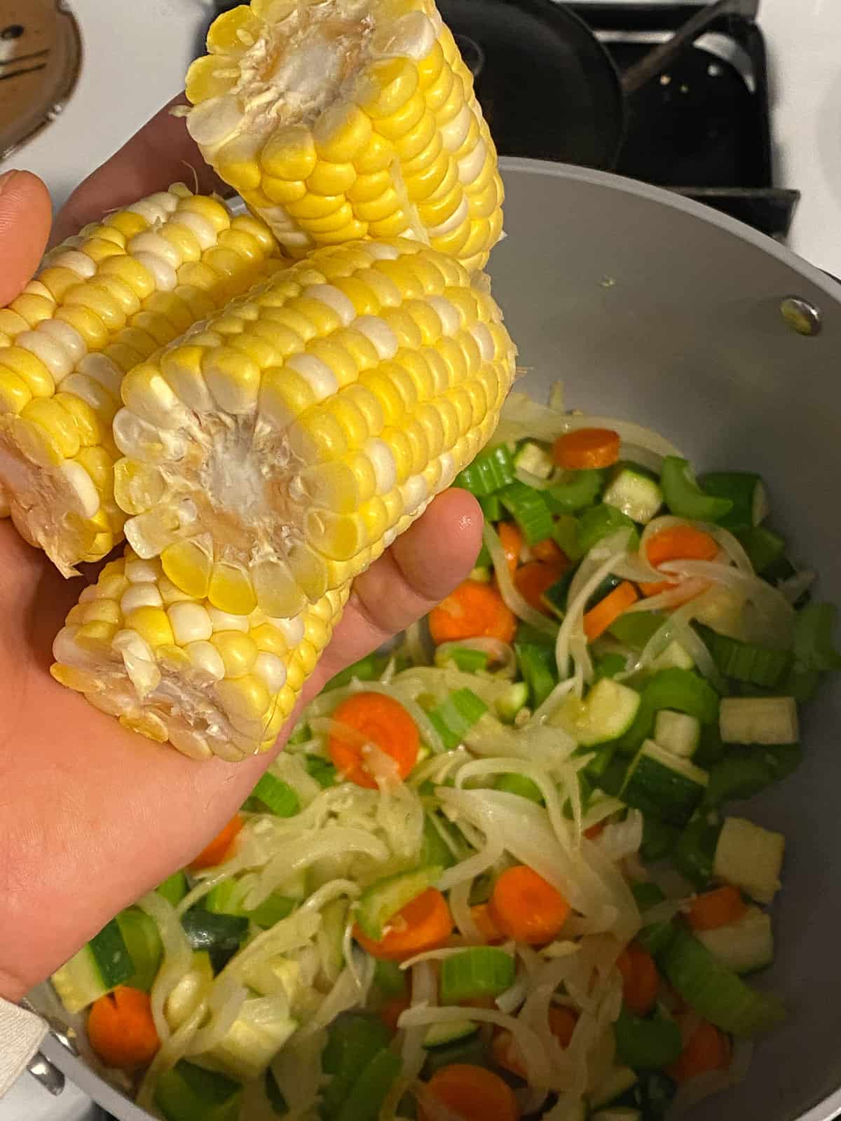 process of adding corn to pan
