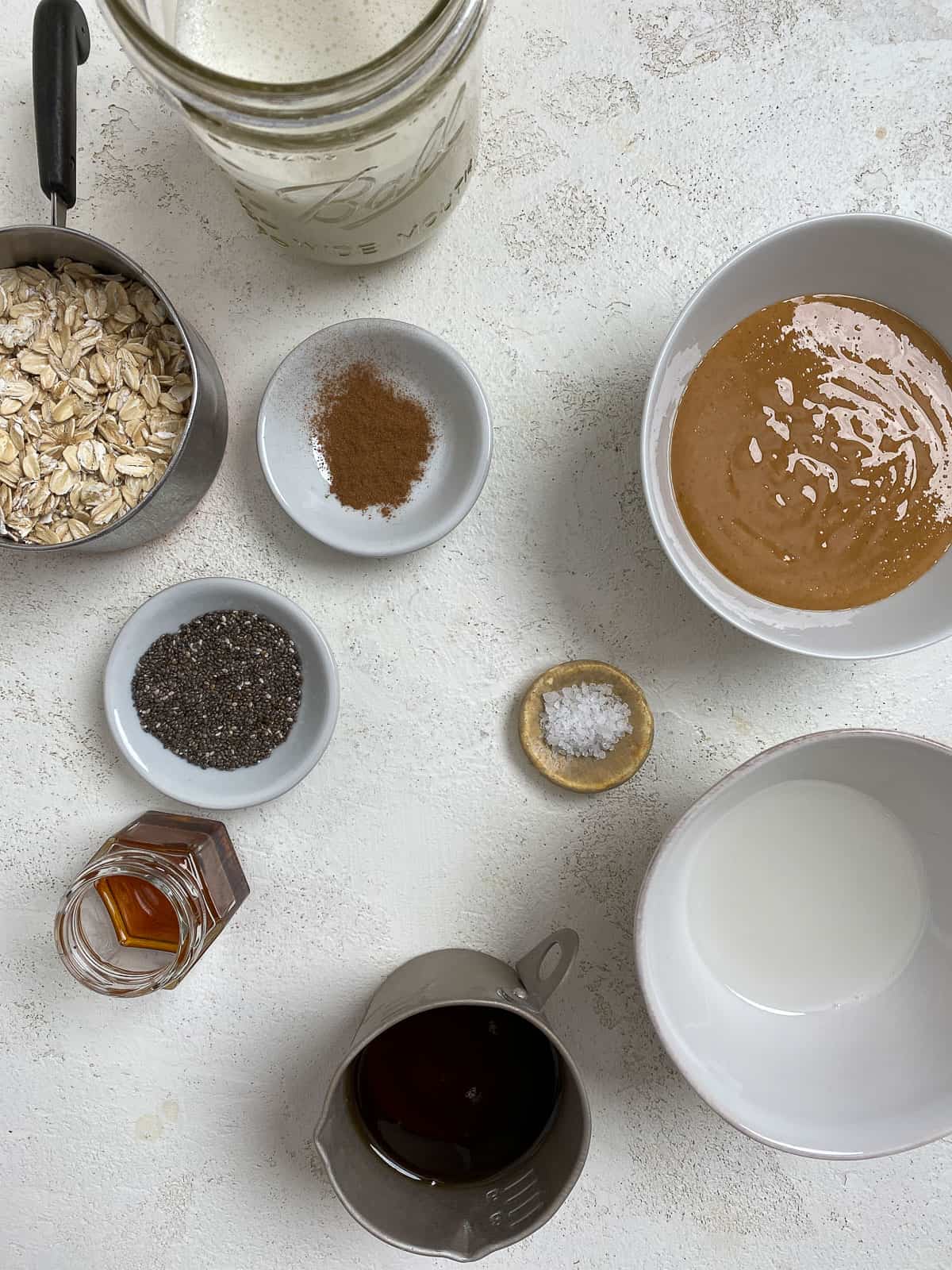 ingredients for Salted Caramel Overnight Oats measured out against a white background