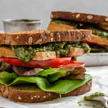 two completed Tofu and Pesto Sandwiches against a light surface