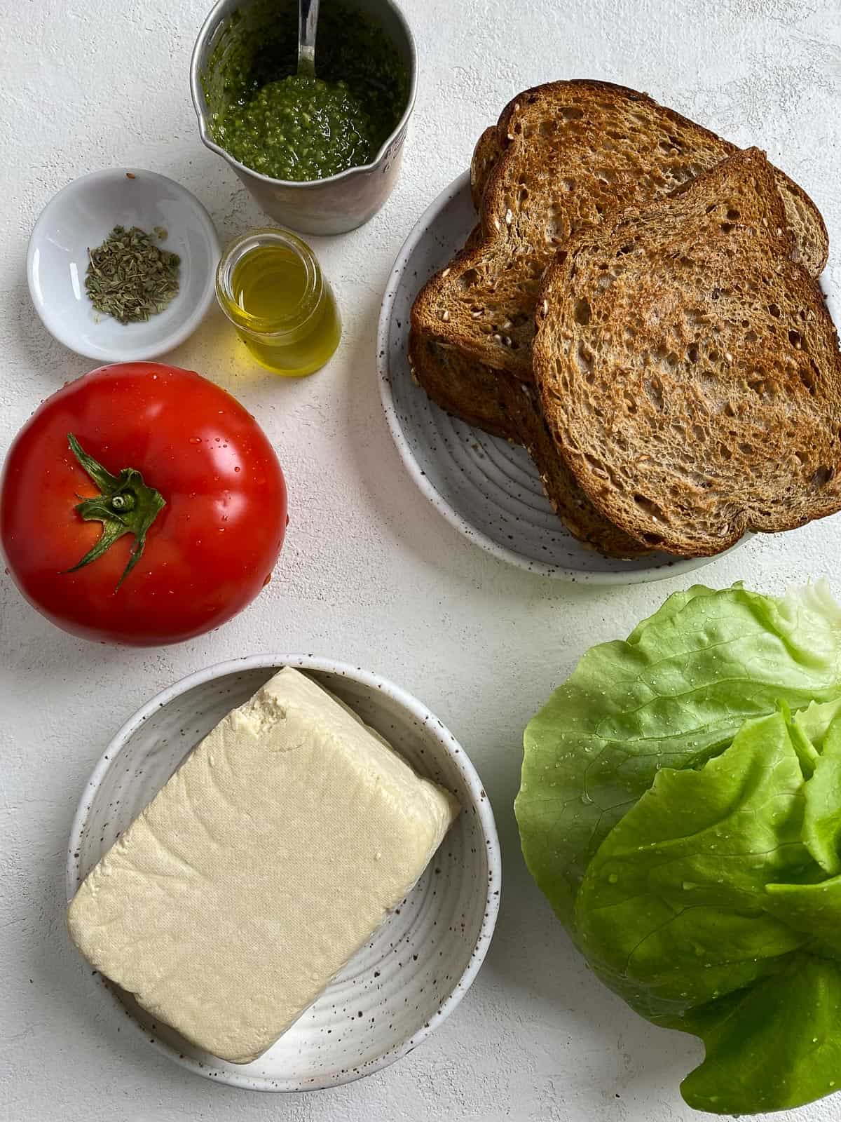 ingredients for Tofu and Pesto Sandwich measured out against a light surface
