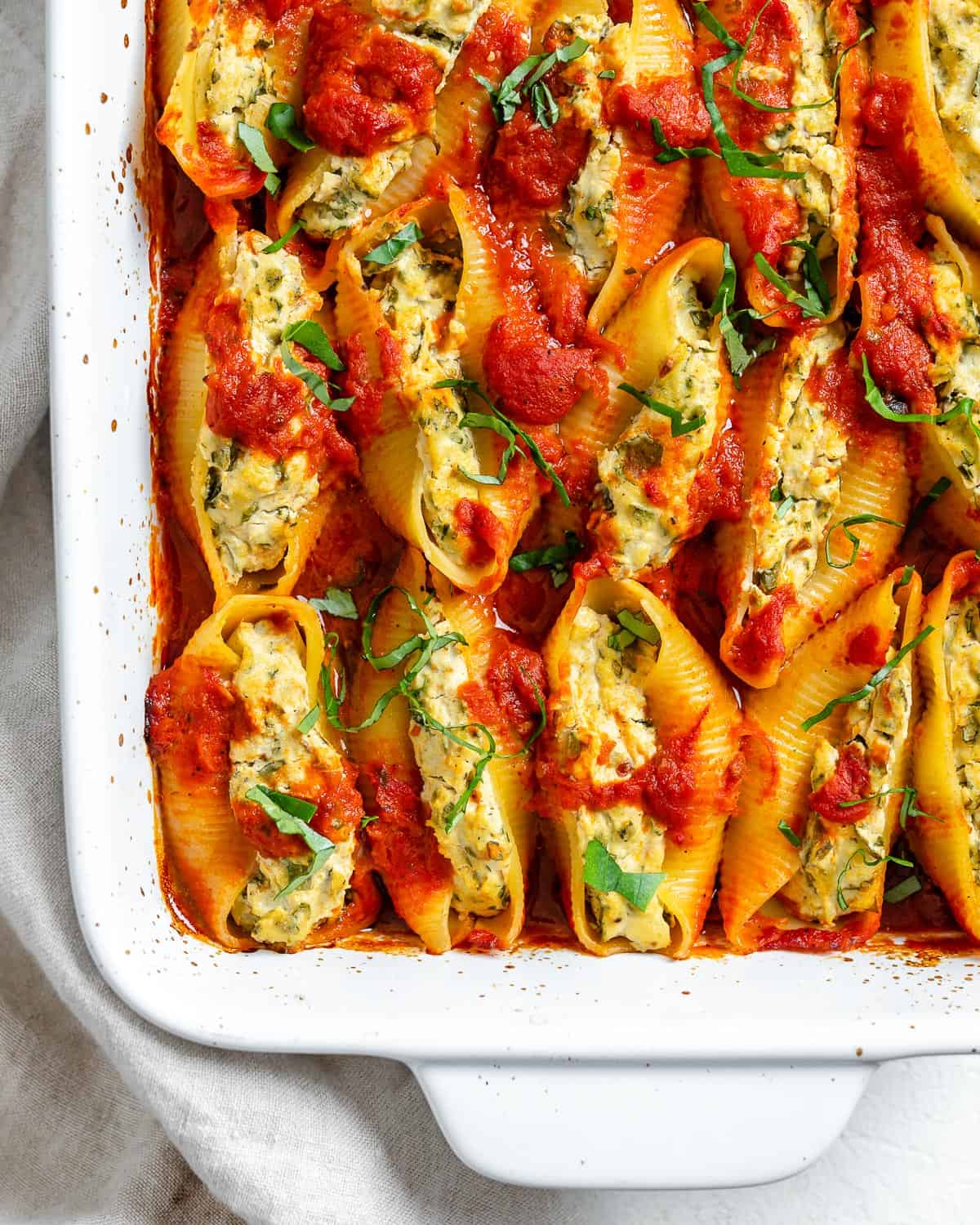 These Stuffed Shells are the ultimate delicious comfort food! Everyone will enjoy this tasty, wholesome meal. #plantbasedonabudget #stuffed #shells #dinner #vegan.