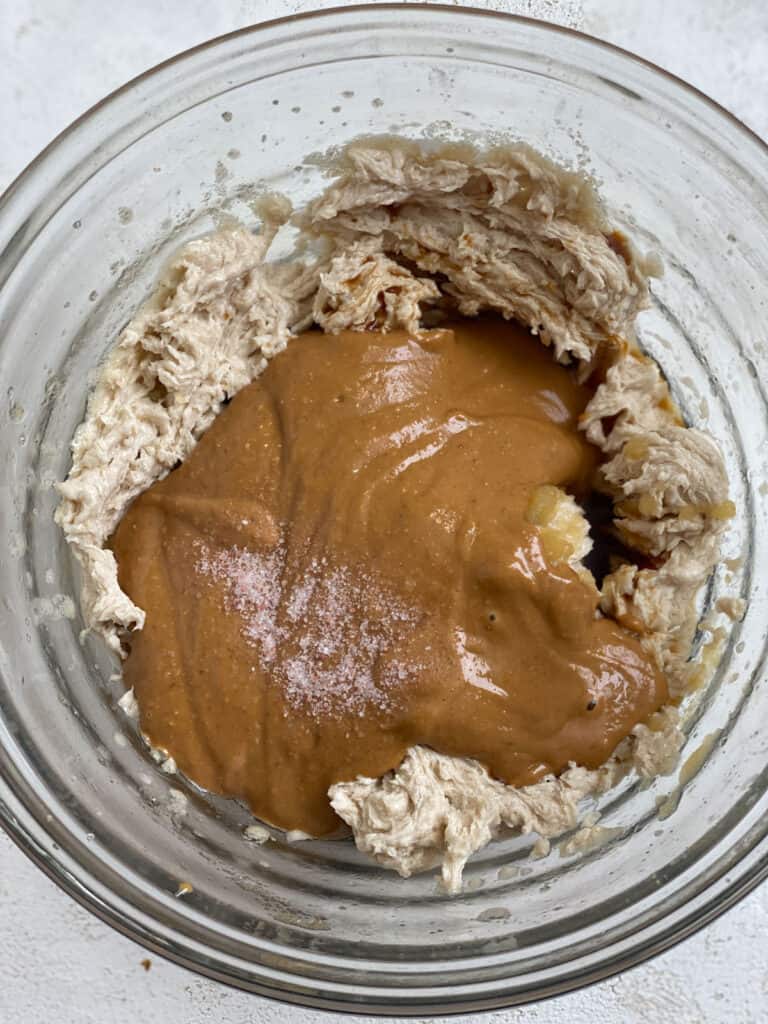 process shot of adding peanut butter to glass jar