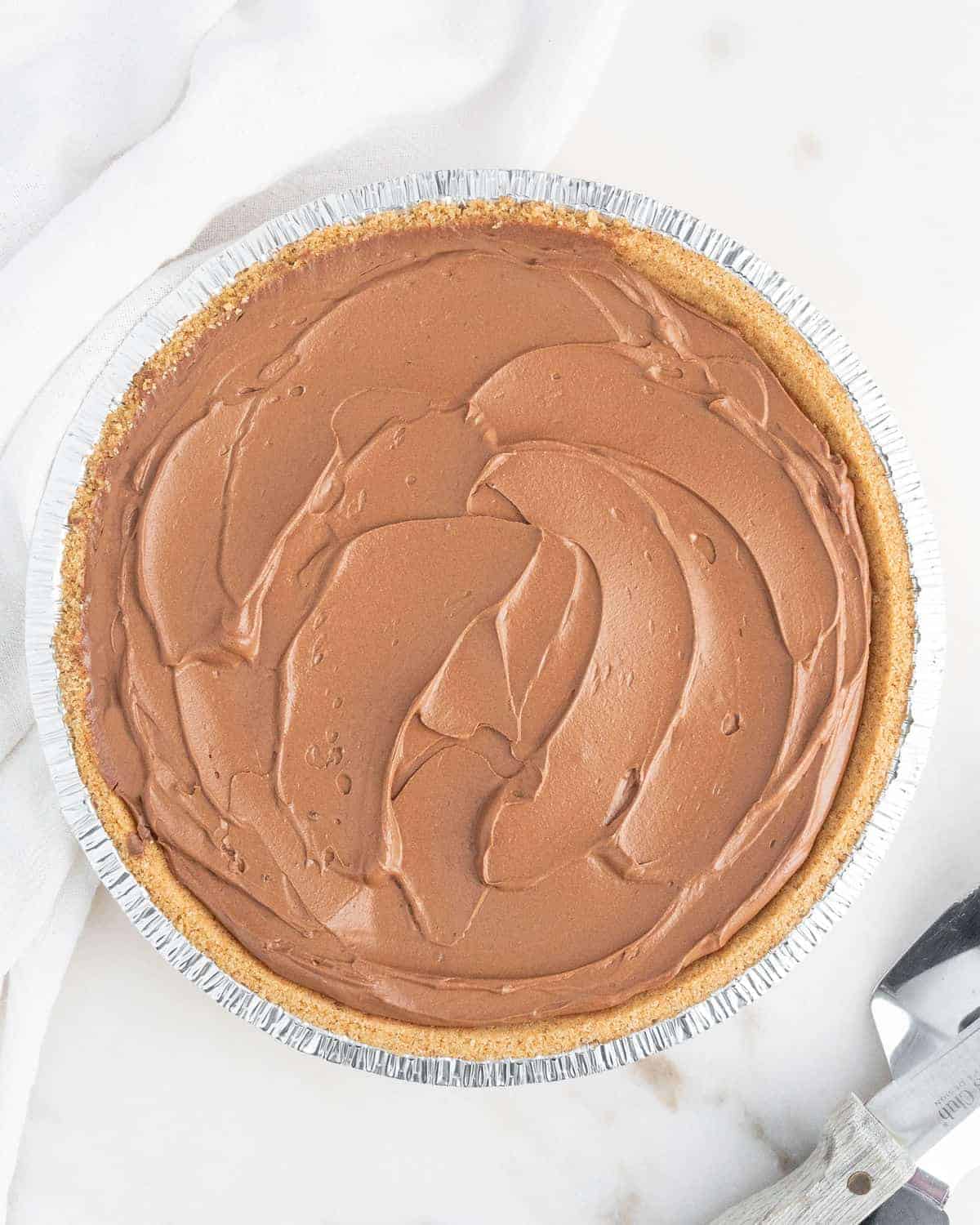 completed chocolate pie against light surface