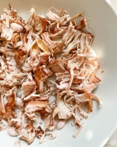 cooked shredded jackfruit spread out against white surface