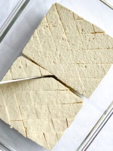 process of making diagonal cuts in two blocks of tofu