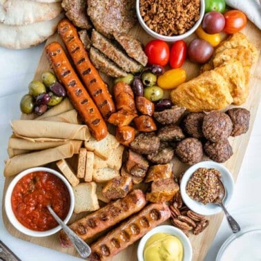 variety of plant based meats on a platter in a white background