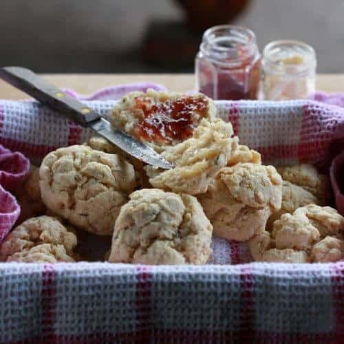 Towel-lined basket filled with vegan biscuits.
